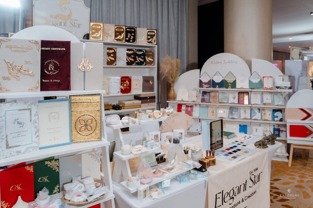 Elegant Star studio display with invitations and finishing samples
